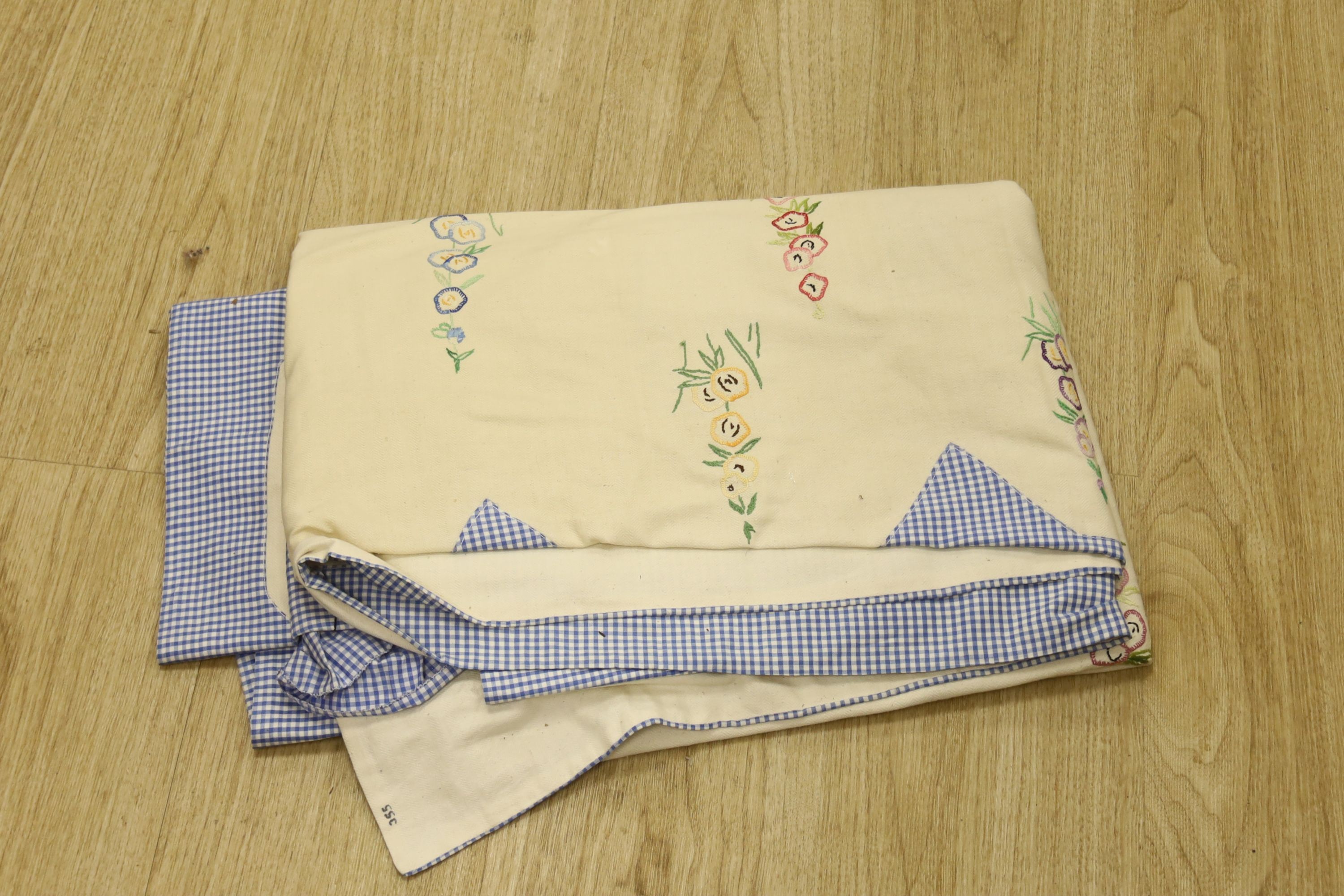 Two embroidered and appliquéd bed covers designed with ladies wearing crinoline dresses